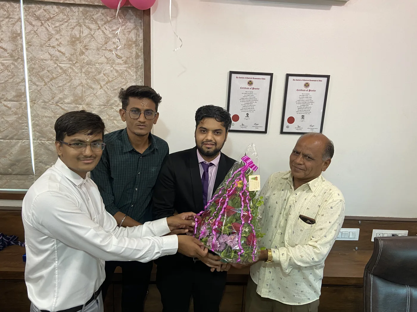A bouquet being presented to a guest in the office